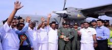 Chief Minister Oommen Chandy and others hailing the first landing (test flight) of aircraft at Kannur airport