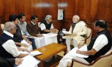 Kerala Chief Minister Oommen Chandy and Ministers with Prime Minister Narendra Modi in New Delhi on Friday