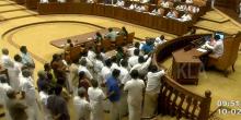 Opposition protesting in Kerala Asssembly on Wednesday