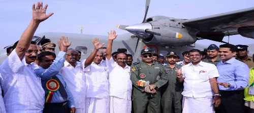 Chief Minister Oommen Chandy and others hailing the first landing (test flight) of aircraft at Kannur airport