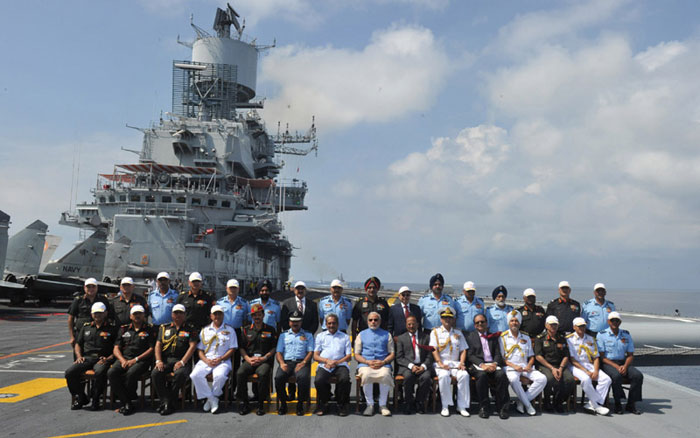Prime Minister Narendra Modi in a group photograph at the INS Vikramaditya, on December 15