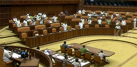 Opposition protesting in Kerala Asssembly on Wednesday